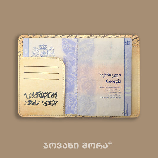 Inside view of beige Independence Act vegan leather passport holder with Georgian passport