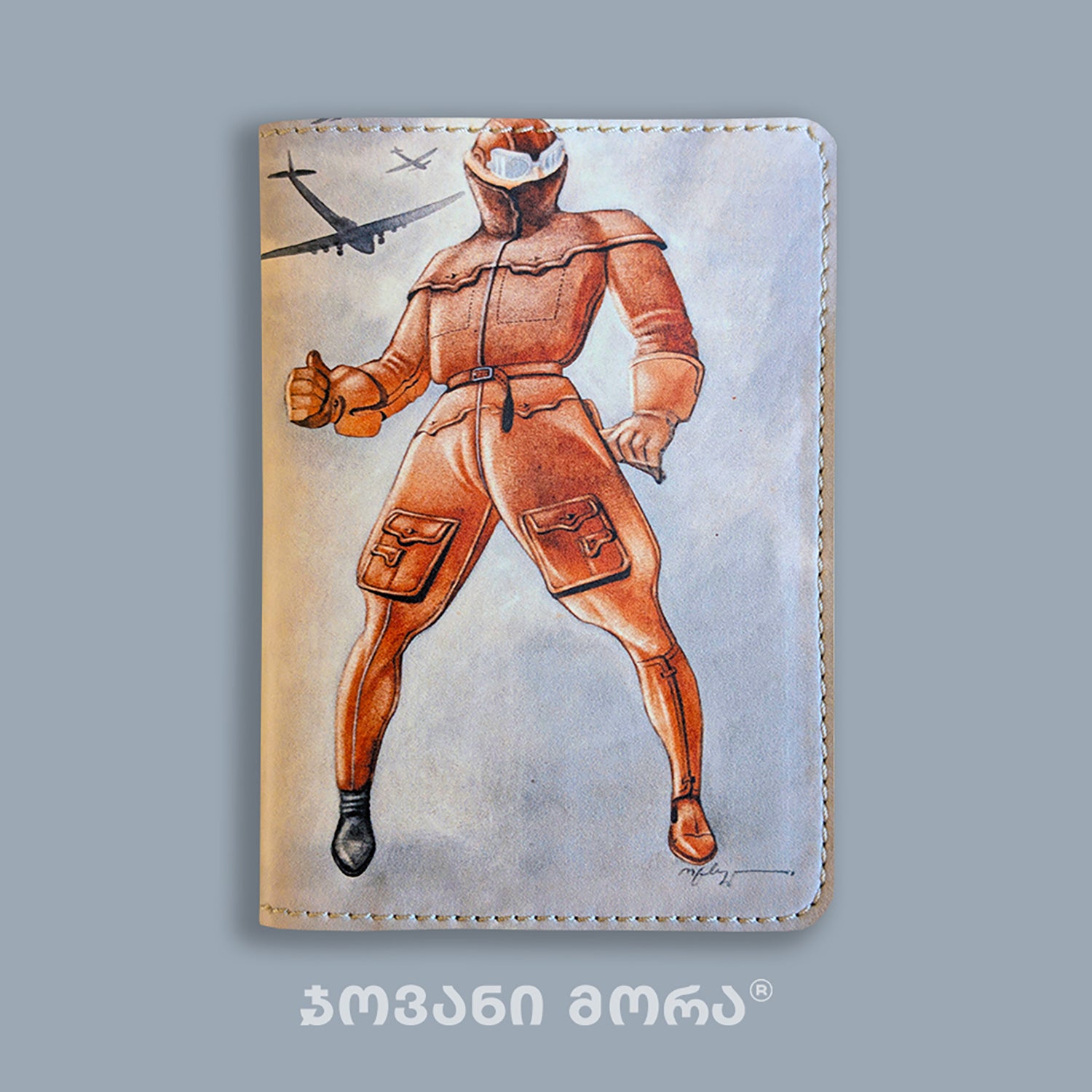 Folded beige vegan leather passport holder with Flying Painter illustration by Giovanni Morra